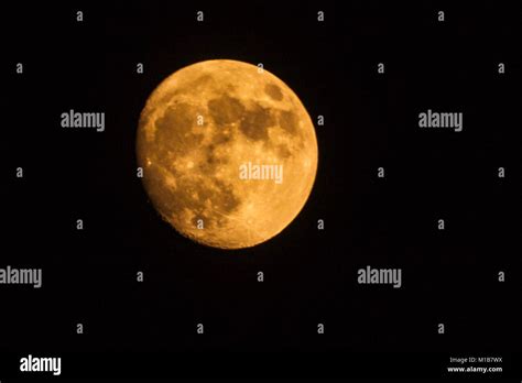 Red Moon In The Sky Astro Photo Of The Almost Full Moon Stock Photo Alamy