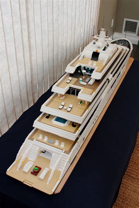 A Model Of A Cruise Ship Sitting On Top Of A Bed