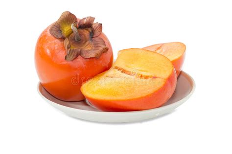 One Whole And Cut In Half Of Persimmon On Saucer Stock Image Image Of