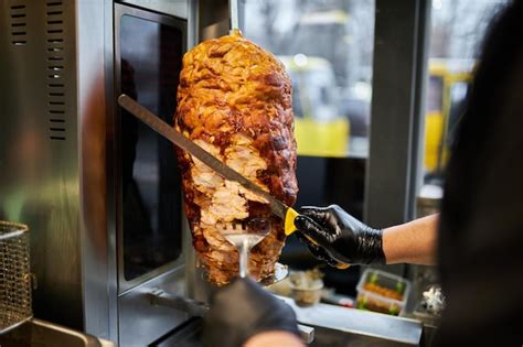 premium photo shawarma lamb on a spit street food doner kebab on a rotating spit a street food