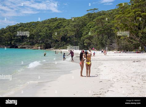 two girls in bikinis take a selfie at murray s beach in booderee