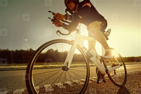 The Sportsman On Bike Riding In Sunset Stock Photo 136508
