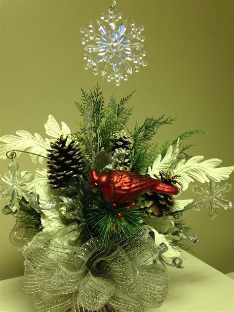 Leaving flowers on the graves of loved ones is a special practice. Christmas and winter flower arrangement for the grave vase ...