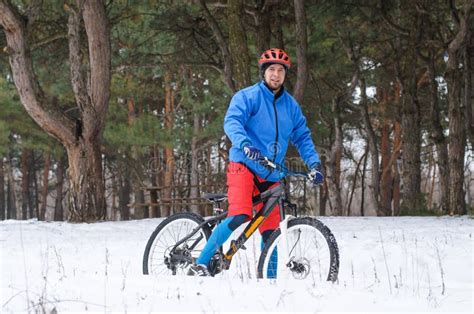 Extreme Mountain Biking In The Snow Covered Forest Stock Photo Image