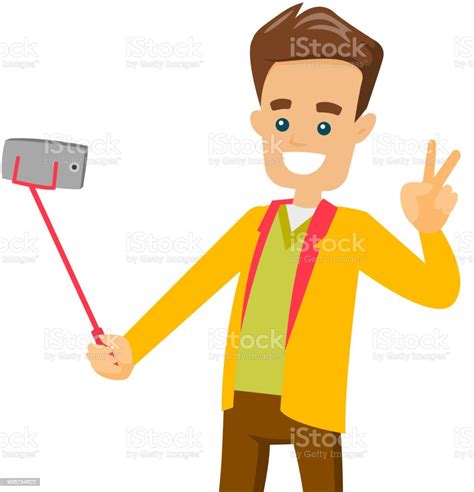 A White Man Making Selfie On His Cellphone With A Selfie Stick Stock