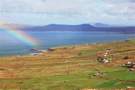 A Rainbow Off The Shoreline Over The Water Near Waterville With