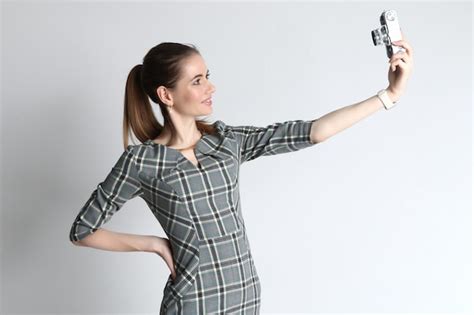 Premium Photo Young Woman Takes A Selfie With The Help Of A Vintage