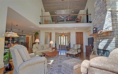 The Great Room And A View Of The Loft Above With A Look Out Space The