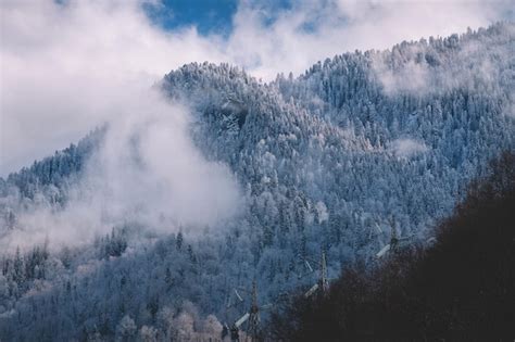 Premium Photo Snowy And Foggy Mountains