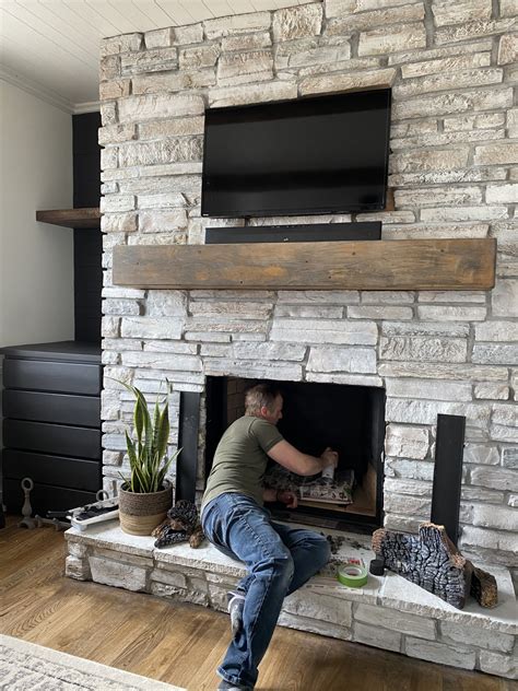 I loved the stone fireplace in our home but it was more of an eyesore than a feature. Whitewashed fireplace revamp-42 - Designs By Karan