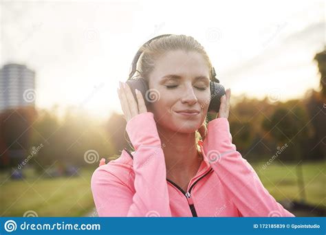 Woman With Headphones Listening To Music Outdoors Stock Image Image