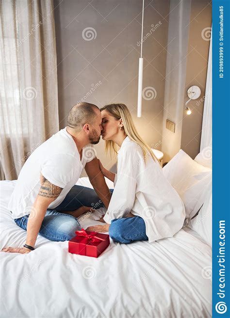loving couple kissing each other on the bed stock image image of beautiful love 209893999