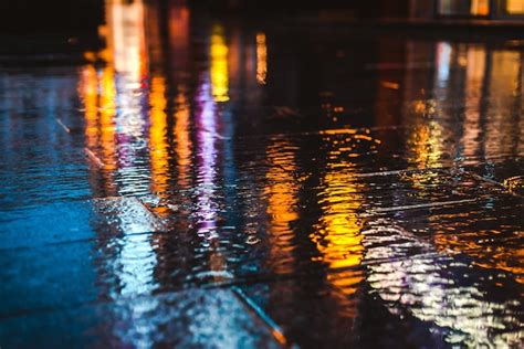Premium Photo Rainy Night In A Big City Reflections Of Lights On The
