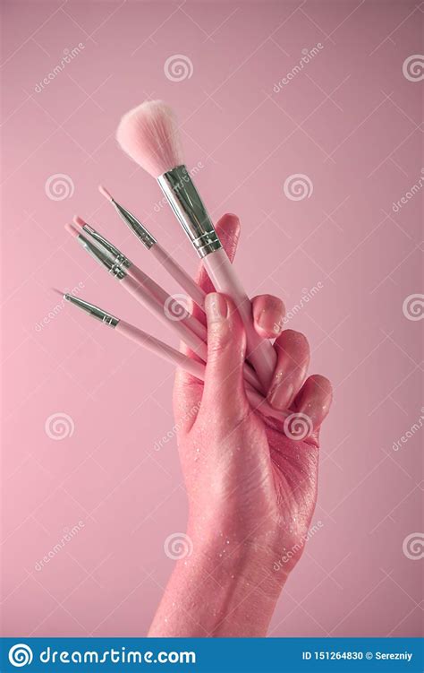 Woman Holding Makeup Brushes On Color Background Stock Photo Image Of