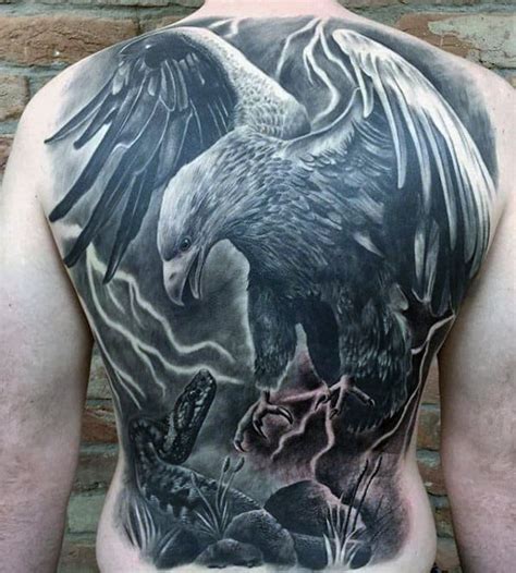 An eagle tattoo is a popular choice not only on men but also on women. 50 Eagle Back Tattoo Designs For Men - Flying Bird Ink Ideas