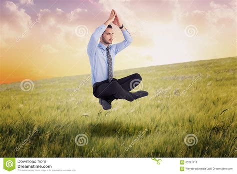 Composite Image Of Calm Businessman Sitting In Lotus Pose With Hands