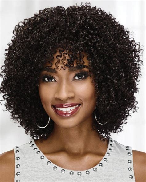 on trend curly wig with voluminous layers of tight bouncy spiral curls shoulder length wigs