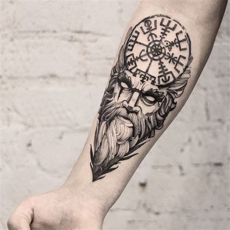 A Mans Arm With A Clock And Beard Tattoo On It
