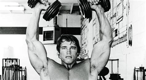 master the arnold press for big shoulders muscle and fitness