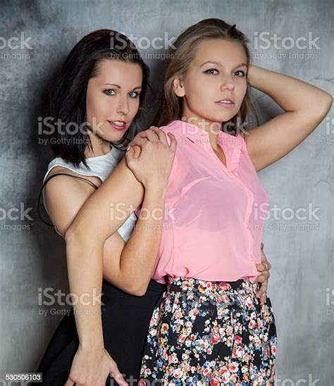 Two Beautiful Girls Hugging Each Other Stock Photo Download Image Now