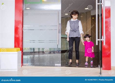 Woman Picking Up Her Child From A Kindergarten Stock Image Image Of