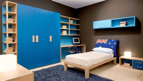 Simple boys' room design with several bookcases two display all those cool things. Kids room Design Ideas