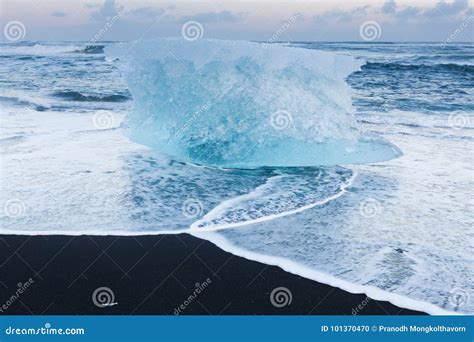 Natural Freezing Iceberg Over Black Sand Beach Iceland Stock Photo
