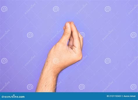 Hand Of Caucasian Young Man Showing Fingers Over Isolated Purple