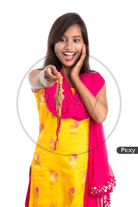 Image Of Beautiful Indian Girl Showing Rakhis On Occasion Of Raksha
