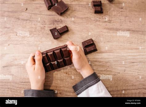 Boys Hands Holding Chocolate Bar Hi Res Stock Photography And Images