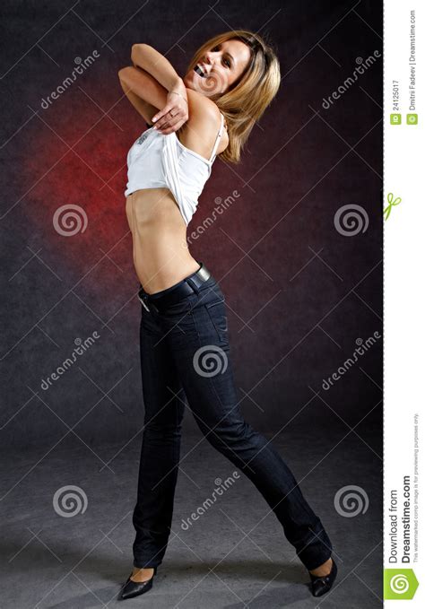 Cheerful Young Woman Taking Off Her Clothes Royalty Free Stock