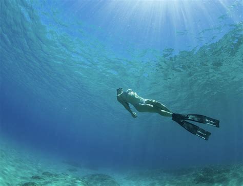 Woman Swimming In Pacific Ocean Photograph By Panoramic Images