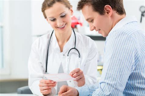 Doctor With Patient In Clinic Consulting Stock Image Image Of