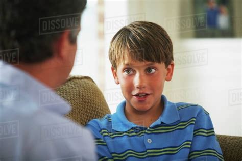 A Father And Son Talking Together Stock Photo Dissolve