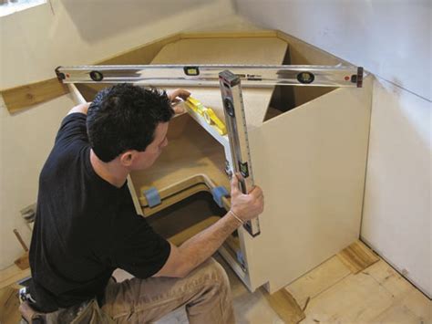 Steps for installing kitchen cabinet crown molding. Installing Kitchen Cabinets - Restoration & Design for the ...