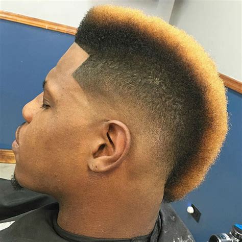 The top hairstyles for black men usually have a low or high fade haircut with short hair styled someway on top. Black Men's Mohawk Hairstyles | Men's Hairstyles ...