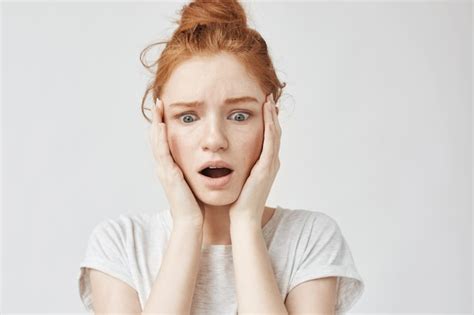 Free Photo Portrait Of Surprised Upset Redhead Woman With Hands On