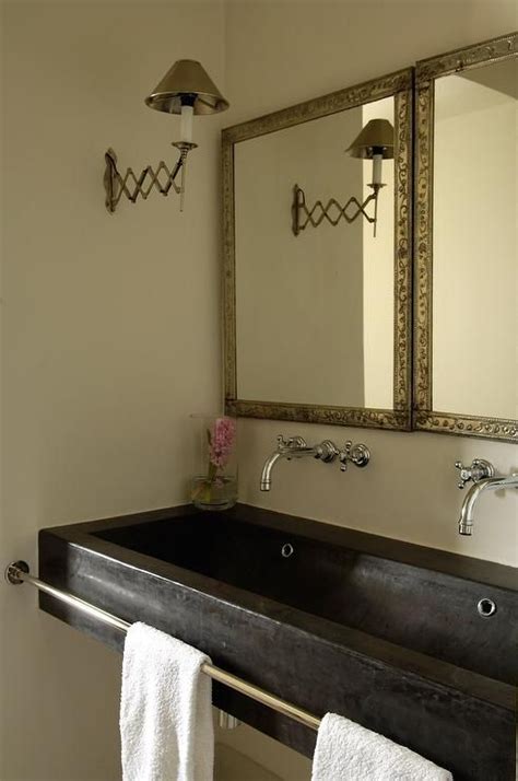 Chic Cottage Bathroom Features A Black Trough Sink Accented With A