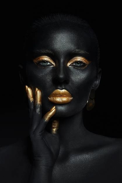 Premium Photo Beauty Woman Painted In Black Skin Color Body Art Gold Makeup Lips Eyelids