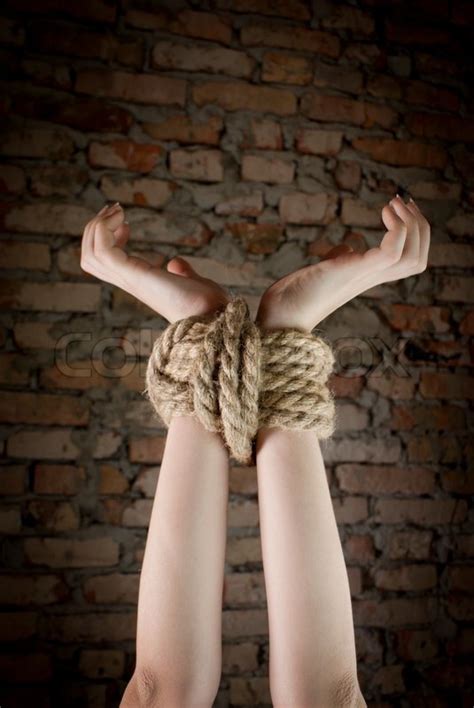 Hands Tied Up With Rope Stock Photo Colourbox