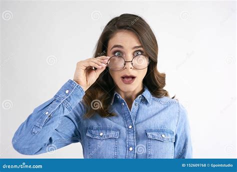 Portrait Of Surprised Woman With Glasses In Studio Shot Stock Photo Image Of Mouth Open