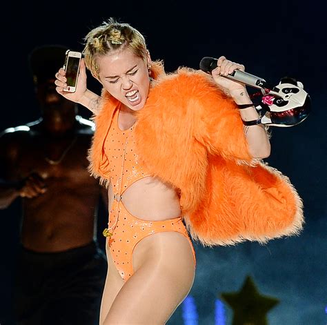 Miley Cyrus Most Outrageous Outfits Photos Wwd