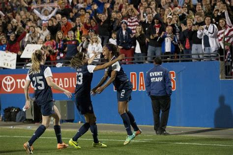 sydney leroux celebrates her goal against canada with christen press and morgan brian cooper