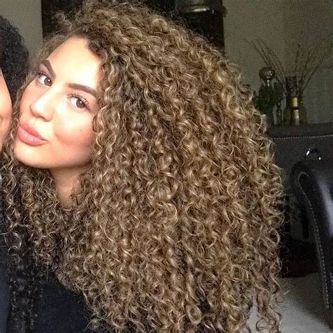 How To Keep Your Curls From Frizzing Up This Winter Curlyhair Com