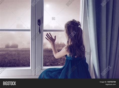 Sad Girl Looking Through Window Image And Photo Bigstock