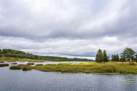 Autumn Landscape With A River And A Cloudy Sky On An Overcast Da Stock