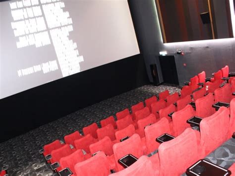 Neutral tones of creamy beige and brown, black mirror glass, stainless steel and dark oak timber panels along the cinema corridor are the key finishes and materials that set the tone for a warm elegant. cinema.com.my: TGV opens new LUXE hall