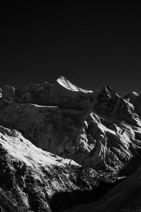 Grayscale Photo Of A Snow Covered Mountain · Free Stock Photo