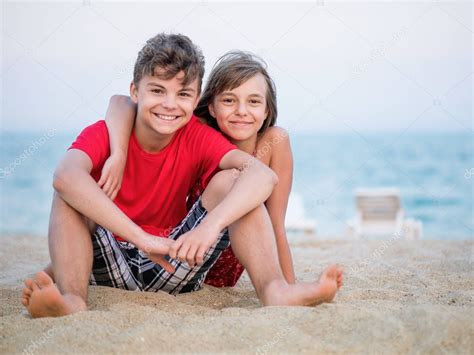 Brother And Sister Playing On Beach — Stock Photo © Valiza 188388862
