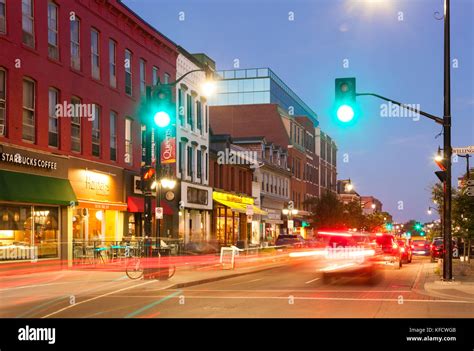 Cars Driving By Historical Buildings Along Princess Street At Dusk In